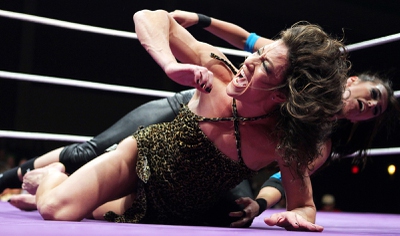 Jungle Grrrl, bottom, wrestles with The Gamer during Women of Wrestling at the Eastside Cannery  in Las Vegas on Saturday, January 19, 2013.