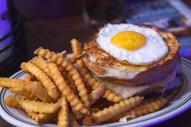 A Cubana Burger is displayed during the second annual Burning Angel porn brunch at the Rattlecan restaurant in the Venetian Sunday, Jan. 20, 2013. The burger consists of sauteed ham, pickle, Swiss cheese, and mustard with a fried egg on top. The brunch follows the AVN Adult Entertainment Expo which ended Saturday. About 40 guests joined adult film actresses as they downed signature "Pickleback" shots and rode a mechanical pickle, a drink concept that was inspired at the 2012 brunch.
