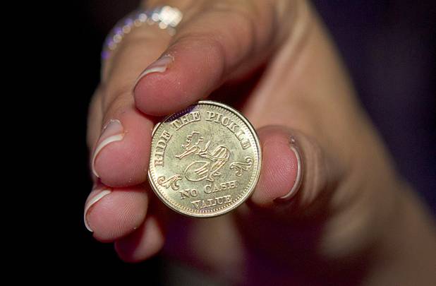 A pickle token, used to ride the mechanical pickle, is displayed during the second annual Burning Angel porn brunch at the Rattlecan restaurant in the Venetian Sunday, Jan. 20, 2013. The brunch follows the AVN Adult Entertainment Expo which ended Saturday. About 40 guests joined adult film actresses as they downed signature "Pickleback" shots and rode a mechanical pickle, a drink concept that was inspired at the 2012 brunch.