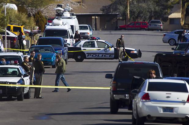 Law enforcement officials investigate a shooting in Boulder City, Jan. 21, 2013.