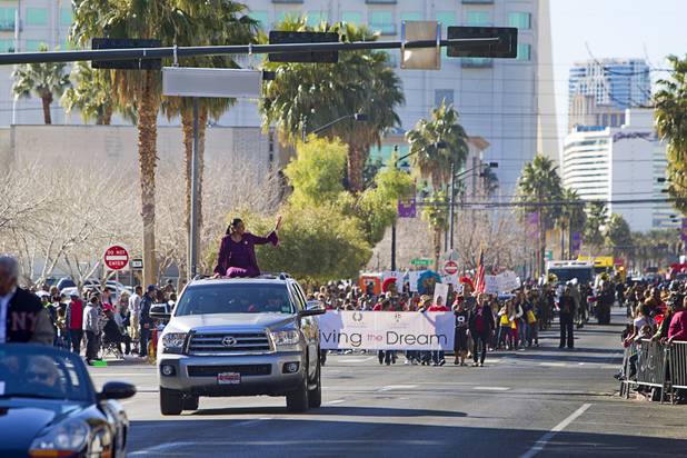 Lillian McMorris, left, one of the parade grand marshals, waves during the 31st annual Martin Luther King Jr. parade in downtown Las Vegas, Monday, Jan. 21, 2013. MGM Resorts International was the presenting sponsor for the event.