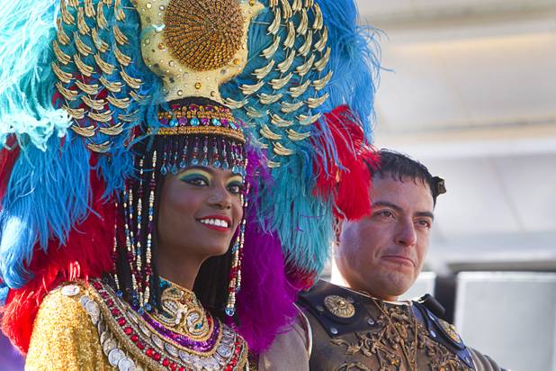 Actors portraying Cleopatra and Mark Antony ride with a Caesars Entertainment/Caesars Foundation entry during the 31st annual Martin Luther King Jr. parade in downtown Las Vegas, Monday, Jan. 21, 2013. MGM Resorts International was the presenting sponsor for the event.
