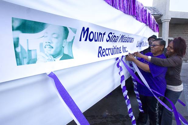 Pastor S.S. Rogers, Janet Edwards, center, and Freda Roby work on a Mt. Sinai Missionary Church parade float during the 31st annual Martin Luther King Jr. parade in downtown Las Vegas, Monday, Jan. 21, 2013. MGM Resorts International was the presenting sponsor for the event.