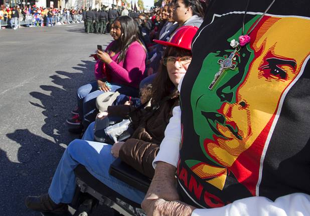 A spectator wears a T-shirt with the image of President Barack Obama during the 31st annual Martin Luther King Jr. parade in downtown Las Vegas, Monday, Jan. 21, 2013. MGM Resorts International was the presenting sponsor for the event.
