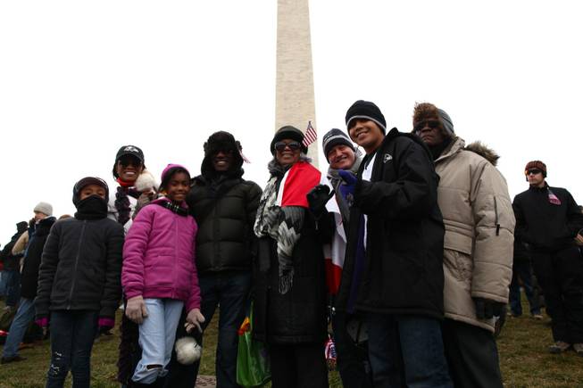 The Green-Reed-Dieterich family from Toronto, Canada and Munich, Germany poses for a group photo in front of the Washington Monument, Monday, Jan. 21, 2013. Adults in the photo from left to right: Vanessa Reed of Virginia, Dave Green of Munich, Germany, Maisie Green of Toronto, Canada, Darin Dieterich of Munich, Germany, and Winston Green of Toronto, Canada.