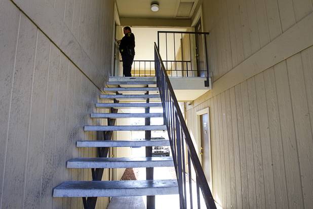 Deputy Constable Patrick Geary tapes a 24-hour eviction notice on the door of an apartment  in the southwest part of the Las Vegas Valley Tuesday, Jan. 22, 2013. Apartment managers can post the notice themselves but often hire a constable for an official posting so they have evidence in case the eviction is contested in court, he said.