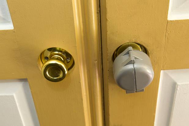 A Kee Blok "donut" is shown over a door knob after an eviction Tuesday, Jan. 22, 2013. Kee Bloks are devices for blocking the access to the doorknob so the evicted tenant cannot return to the apartment.