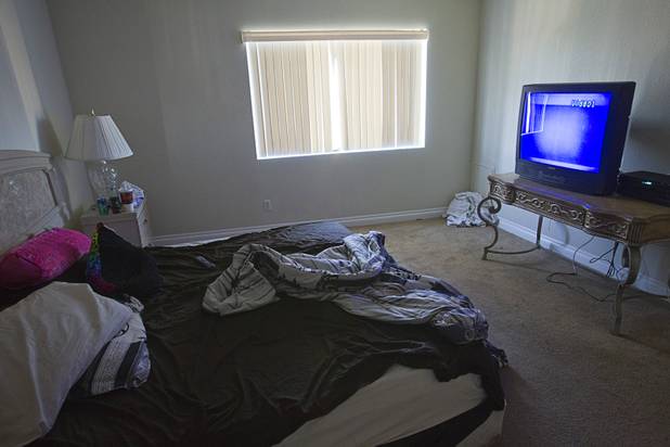 A bedroom is shown during an eviction at a furnished apartment near Desert Inn Road and Joe W. Brown Drive Tuesday, Jan. 22, 2013. The resident had already moved out.