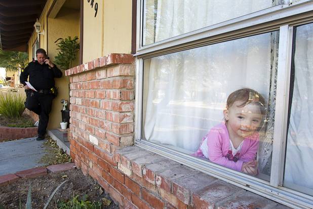Deputy Constable Patrick Geary checks with a landlord during an eviction at a home in the southwest part of the Las Vegas Valley Tuesday, Jan. 22, 2013. The residents of the home were not evicted after they reached a last minute arrangement with the landlord for extra time to move out.
