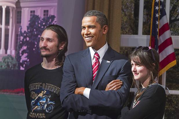 Aurelien, left, and Morgane Valla of France pose with a wax figure of President Barack Obama at Madame Tussauds Las Vegas wax attraction in the Venetian Wednesday, Jan. 23, 2013. On Thursday, the venue will unveil a wax figure of actress Sandra Bullock.