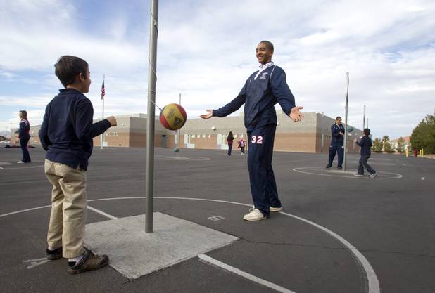 Coronado High School basketball player Justice Augmon plays tetherball with a student at Glen Taylor Elementary School in Henderson on Wednesday, Jan. 23, 2013. Coronado basketball players and cheerleaders take time out of their season to mentor first- and second-graders at the school.