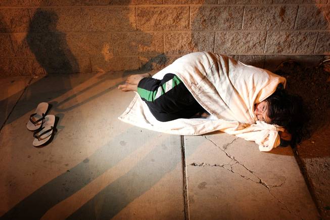 A woman sleeping on A Street is counted by volunteers conducting a census of the homeless in Clark County  in downtown Las Vegas early in the morning on Thursday, January 24, 2013.