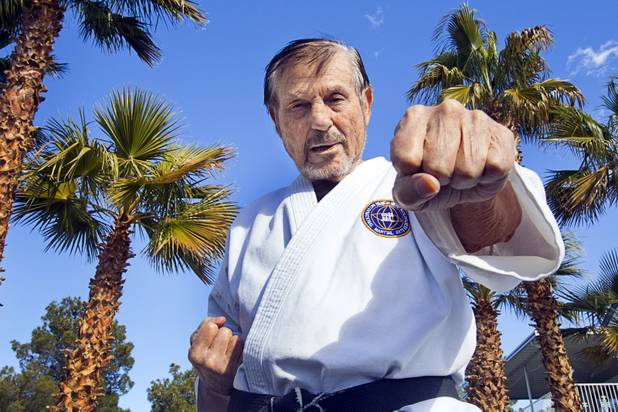 Karate master Dan Sawyer demonstrates his form at his home Sunday, Jan. 27, 2013. Sawyer teaches in a garage behind his home that has been converted into a karate dojo.