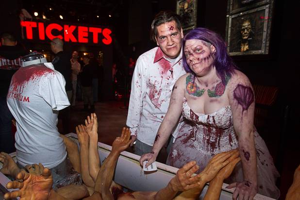 Anthony Gallegos and Rosie Grasso of Las Vegas pose in the lobby at Eli Roths Goretorium before getting married Sunday, Jan. 27, 2013.