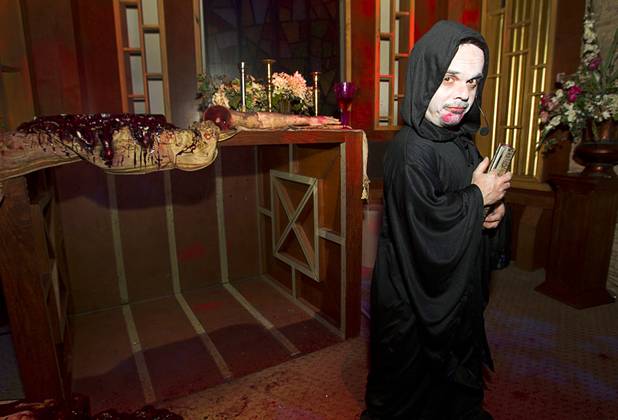 Dimos Greko waits in the chapel before presiding over the wedding of Anthony Gallegos and Rosie Grasso of Las Vegas at Eli Roths Goretorium Sunday, Jan. 27, 2013.