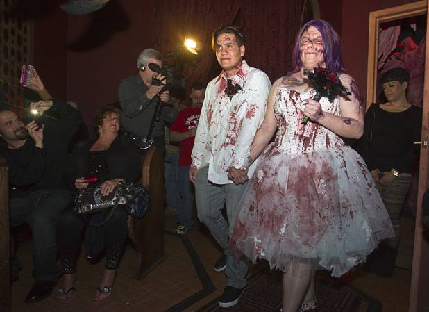 Anthony Gallegos and Rosie Grasso of Las Vegas walk down the aisle as they get married in the chapel at Eli Roths Goretorium Sunday, Jan. 27, 2013.