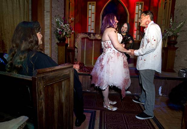 Rosie Grasso and Anthony Gallegos of Las Vegas exchange vows as they get married in the chapel at Eli Roths Goretorium Sunday, Jan. 27, 2013.