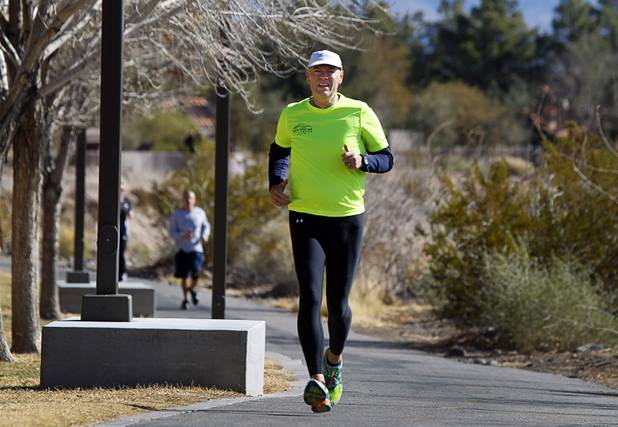 Mark Noel trains along the Pittman Wash in Henderson on Sunday, Jan. 27, 2013. Noel at one time weighed more than 400 pounds but now weighs 185 pounds and is running in the Surf City USA Marathon in California on Feb. 3.