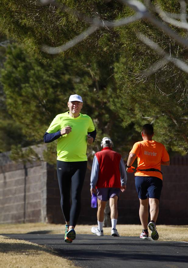 Mark Noel trains along the Pittman Wash in Henderson Sunday, Jan. 27, 2013. Noel, at one time weighed more than 400 pounds, but now weighs 185 pounds and is running in the Surf City USA Marathon in California on Feb 3.