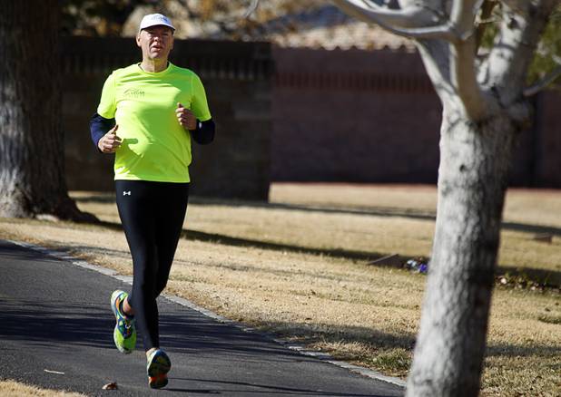 Mark Noel trains along the Pittman Wash in Henderson Sunday, Jan. 27, 2013. Noel, at one time weighed more than 400 pounds, but now weighs 185 pounds and is running in the Surf City USA Marathon in California on Feb 3.