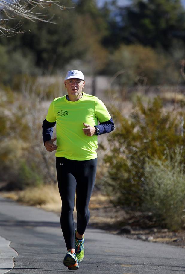 Mark Noel trains along the Pittman Wash in Henderson Sunday, Jan. 27, 2013. Noel, at one time weighed more than 400 pounds, but now weighs 185 pounds and is running in the Surf City USA Marathon in California on Feb 3.