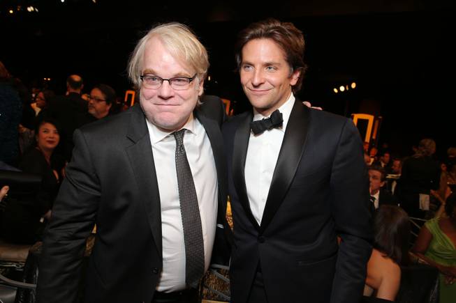 Actors Philip Seymour Hoffman and Bradley Cooper at the 19th Annual Screen Actors Guild Awards at the Shrine Auditorium on Sunday, Jan. 27, 2013, in Los Angeles.