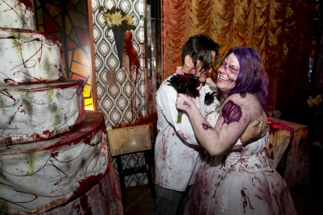 Anthony Gallegos and Rosie Grasso of Las Vegas pose for photos in a wedding reception area after getting married at Eli Roths Goretorium Sunday, Jan. 27, 2013. STEVE MARCUS