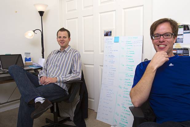 Company co-founders Tom Ellinson, left, and Dean Curtis are shown at the Fandeavor offices in the Ogden in downtown Las Vegas Monday, Jan. 28, 2013. Fandeavor is a sports marketing group that sells special game-day packages to fans.