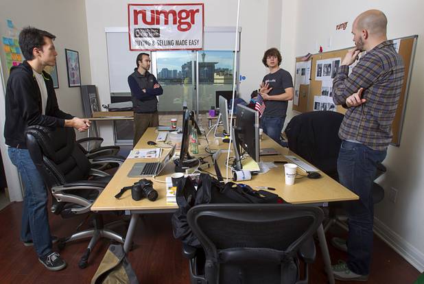 From left, Charles Watkins, Alex Coleman, Ray Morgan and Dylan Bathurst  hold a meeting at the Rumgr offices in downtown Las Vegas Monday, Jan. 28, 2013. Rumgr is an iPhone app designed to let people post items for sale, and for buyers to discover what's for sale around them. 