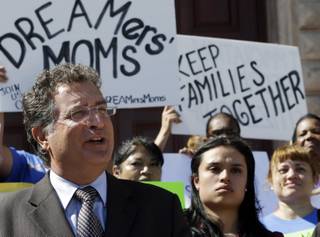 Rep. Joe Garcia, D-Fla, states his support for immigrants and pledges to work in favor of immigration reform to reporters as immigration reform activists protest in front of Freedom Tower in downtown Miami, Monday, Jan. 28, 2013. 