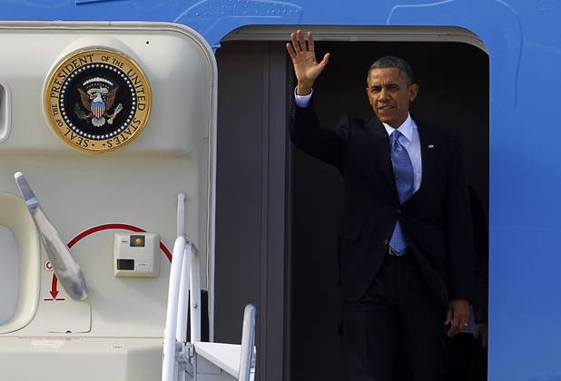 President Barack Obama waves as he arrives to kick off his public push for immigration reform in Las Vegas, Nevada Tuesday, Jan. 29, 2013.