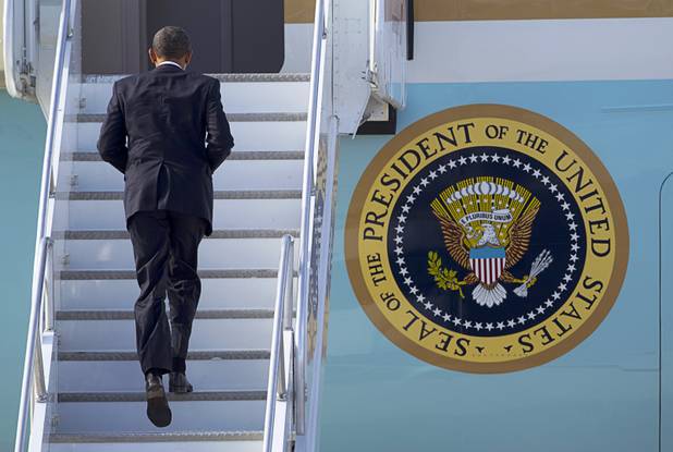 President Barack Obama boards Air Force One at McCarran International Airport after to kicking off his public push for immigration reform in Las Vegas, Nevada Tuesday, Jan. 29, 2013.