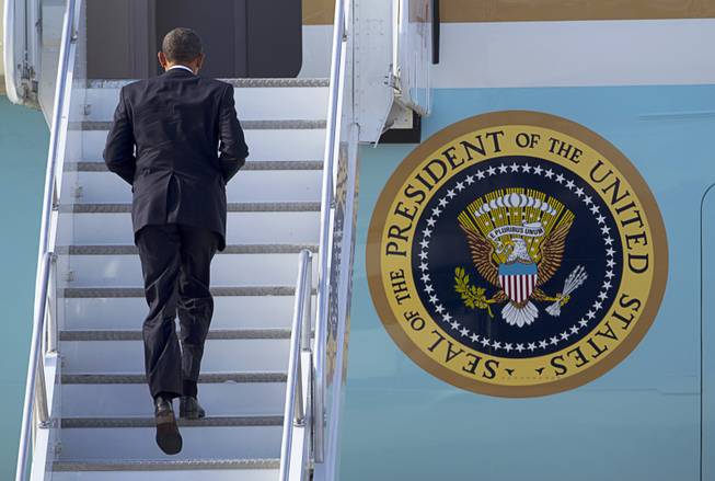 President Barack Obama boards Air Force One at McCarran International Airport after to kicking off his public push for immigration reform in Las Vegas, Nevada Tuesday, Jan. 29, 2013.