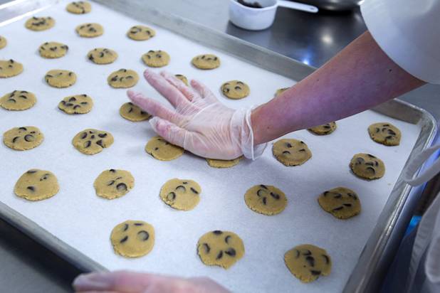 Amanda Coatney flattens gluten-free cookie dough at Jadon Foods, 4343 N. Rancho Drive, Wednesday, Jan. 30, 2013. Jadon Foods is a gluten-free bakery that also specializes in diabetic-friendly and dairy-free baked goods.