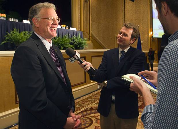 Henderson Mayor Andy Hafen, center, talks with reporters after delivering the Henderson State of the City address at Green Valley Ranch Station Casino Thursday, Jan. 31, 2013.