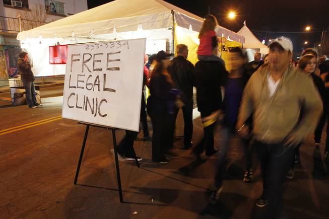 The Callister and Associates law firm dispenses free legal advice at his firm's First Friday booth Friday, Feb. 1, 2013.