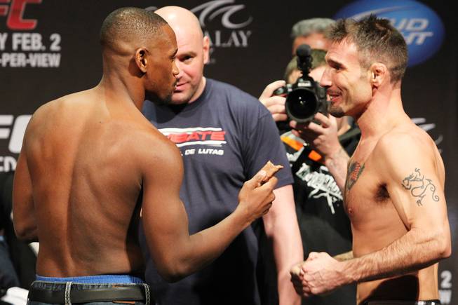 Yves Edwards offers opponent Isaac Vallie-Flagg a bid of his protein bar during weigh ins for UFC 156 Friday, Feb. 1, 2013.
