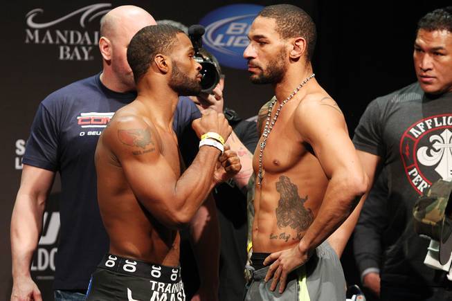 Tyron Woodley, left, and Jay Hieron face off during weigh ins for UFC 156 Friday, Feb. 1, 2013.