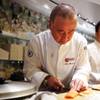 Chef Nobu Matsuhisa prepares fresh salmon for poaching at the new Nobu Restaurant at Caesars Palace in Las Vegas on Friday, February 1, 2013.