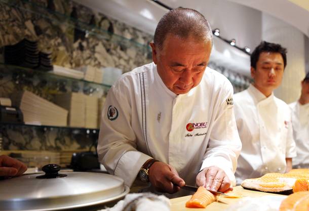 Chef Nobu Matsuhisa prepares fresh salmon for poaching at the new Nobu Restaurant at Caesars Palace in Las Vegas on Friday, February 1, 2013.
