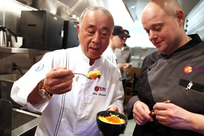 Chef Nobu Matsuhisa tasted the egg donburi he just prepared with Thomas Buckley, the corporate executive chef at the new Nobu Restaurant at Caesars Palace in Las Vegas on Friday, February 1, 2013.