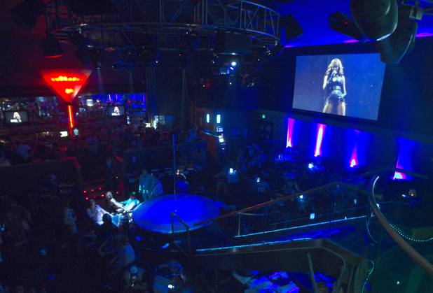 Beyonce is shown on a screen during halftime during a Super Sunday party at the Sapphire Las Vegas strip club Sunday, Feb. 3, 2013.