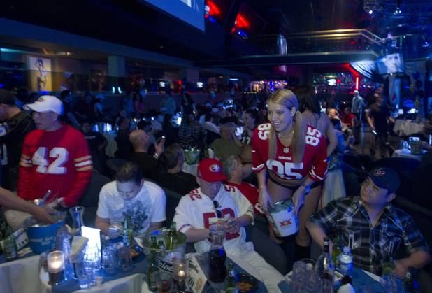 Jersey Girl Shauna sells raffle tickets during a Super Sunday party at the Sapphire Las Vegas strip club Sunday, Feb. 3, 2013.