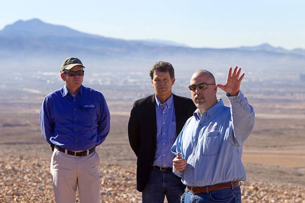 Eddie Ridenour, left, an environmental health supervisor for Southern Nevada Health District, Jeff Scott, center, Environmental Protection Agency waste management division director for region 9, and Todd Whittle, area environmental manager for Republic Services, give a tour of Sunrise Landfill Tuesday, Feb. 5, 2013. In 1998, a storm damaged the landfill cap, sending waste into the Las Vegas Wash and Lake Mead. The tour marked the completion of $36 million in storm control construction.