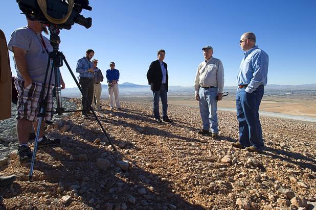 Jeff Scott, left, Environmental Protection Agency waste management division director for region 9, Steve Wall, center, an EPA engineer, and Todd Whittle, area environmental manager for Republic Services, speak to reporters during a tour of Sunrise Landfill Tuesday, Feb. 5, 2013. In 1998, a storm damaged the landfill cap, sending waste into the Las Vegas Wash and Lake Mead. The tour marked the completion of $36 million in storm control construction.