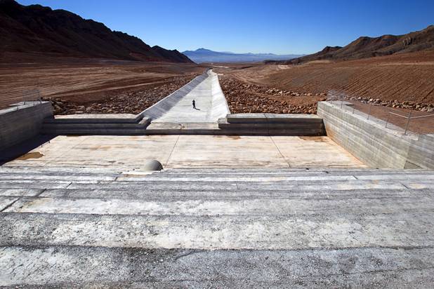 A news photographer takes a photo of a flood control channel during a tour of Sunrise Landfill Tuesday, Feb. 5, 2013. In 1998, a storm damaged the landfill cap, sending waste into the Las Vegas Wash and Lake Mead. The tour marked the completion of $36 million in storm control construction.