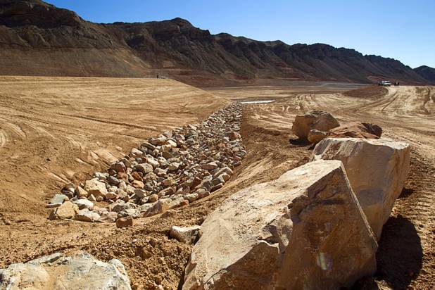 Flood control projects are shown on the top of Sunrise Landfill during a media tour Tuesday, Feb. 5, 2013. In 1998, a storm damaged the landfill cap, sending waste into the Las Vegas Wash and Lake Mead. The tour marked the completion of $36 million in storm control construction.