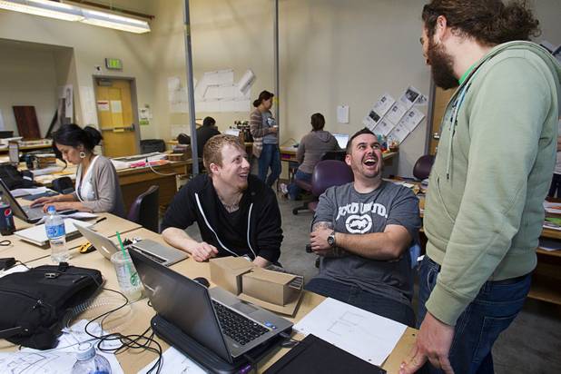 Bryan Oxborrow, left, Levi Unruh, center, and Christian Iusso, members of the UNLV Solar Decathlon team, work in a classroom at the School of Architecture at UNLV Wednesday, Feb. 6, 2013. The solar decathlon is a biennial U.S. Department of Energy-sponsored competition intended to educate the public about energy-saving residential design. UNLV will compete against 19 other schools this October in Irvine, Calif.