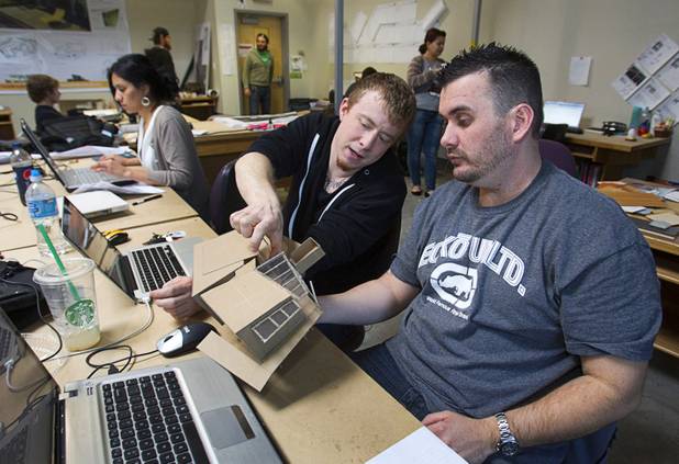 Bryan Oxborrow, left, and Levi Unruh, members of the UNLV Solar Decathlon team, discuss construction details on a study model at the School of Architecture at UNLV Wednesday, Feb. 6, 2013. The solar decathlon is a biennial U.S. Department of Energy-sponsored competition intended to educate the public about energy-saving residential design. UNLV will compete against 19 other schools this October in Irvine, Calif.