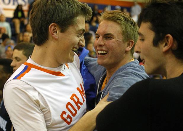 Bishop Gorman's Grant Tucker is congratulated by friends after the Gaels beat Centennial 79-71 in double overtime at Bishop Gorman Thursday, Feb. 7, 2013.